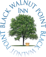 Logo for the Black Walnut Point Inn, a Tilghman Island bed and breakfast, featuring an illustration of a tree and a small wooden bucket.